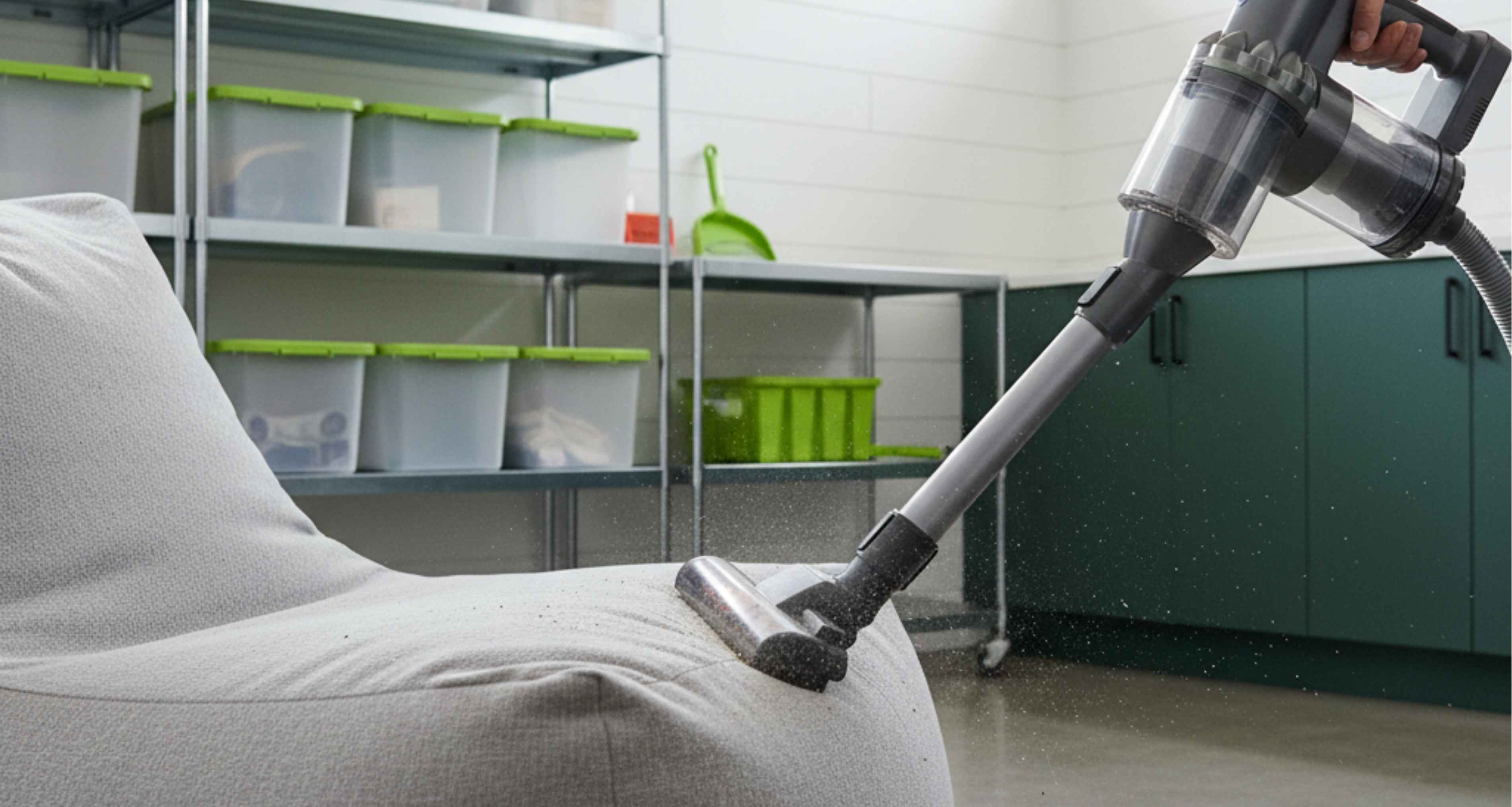Bean bag being cleaned with a vacuum cleaner in a modern utility room setting