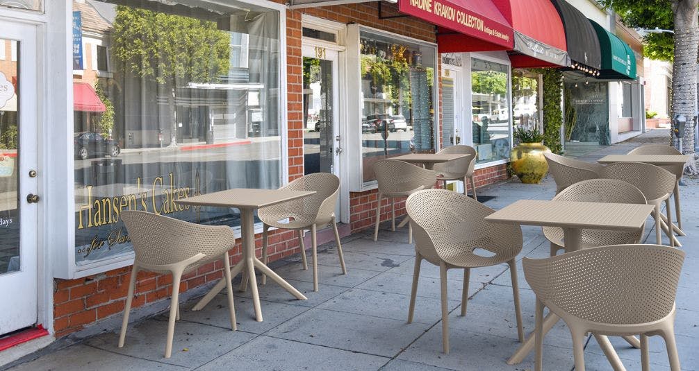 Beige Plastic Bistro Sets Outside Cafe