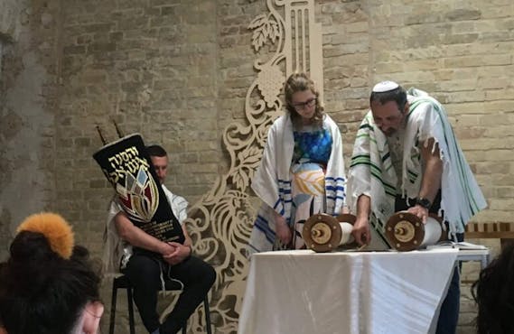 Rabbi Reuven Stamov with congregants during services.