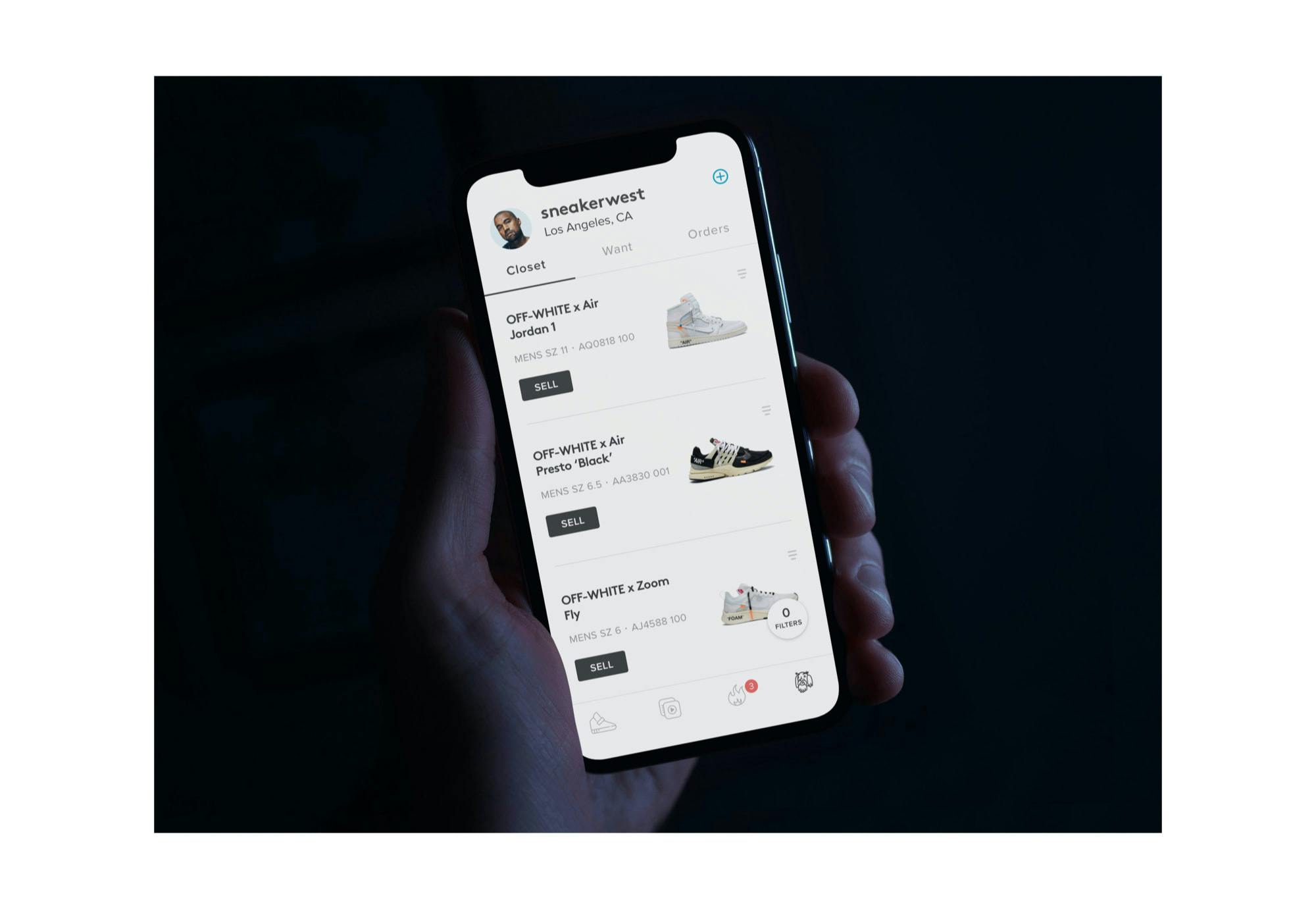 A person holding a phone displaying the closet screen on the Sneaker Con app