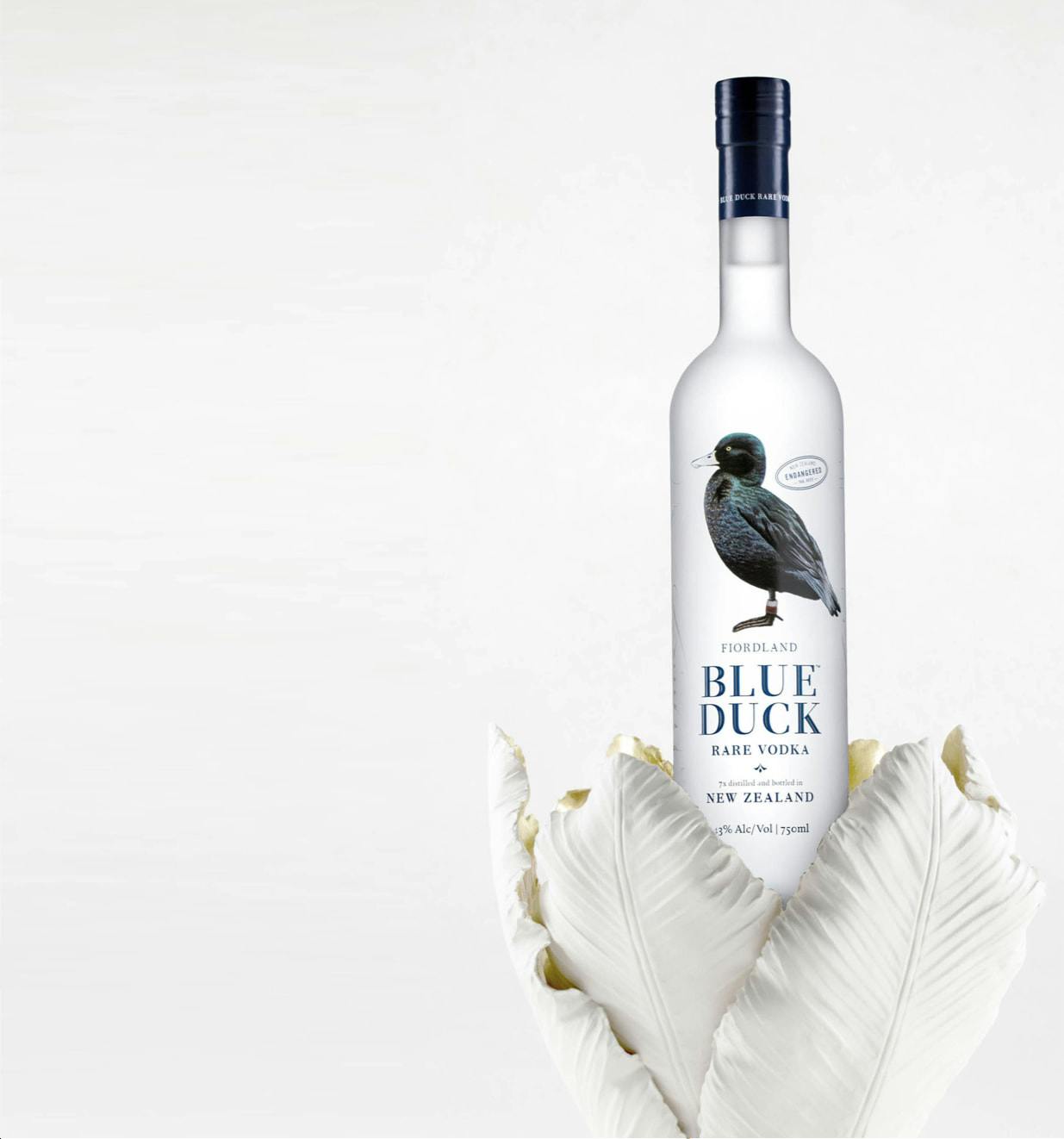 Blue Duck Vodka bottle in artistic vase