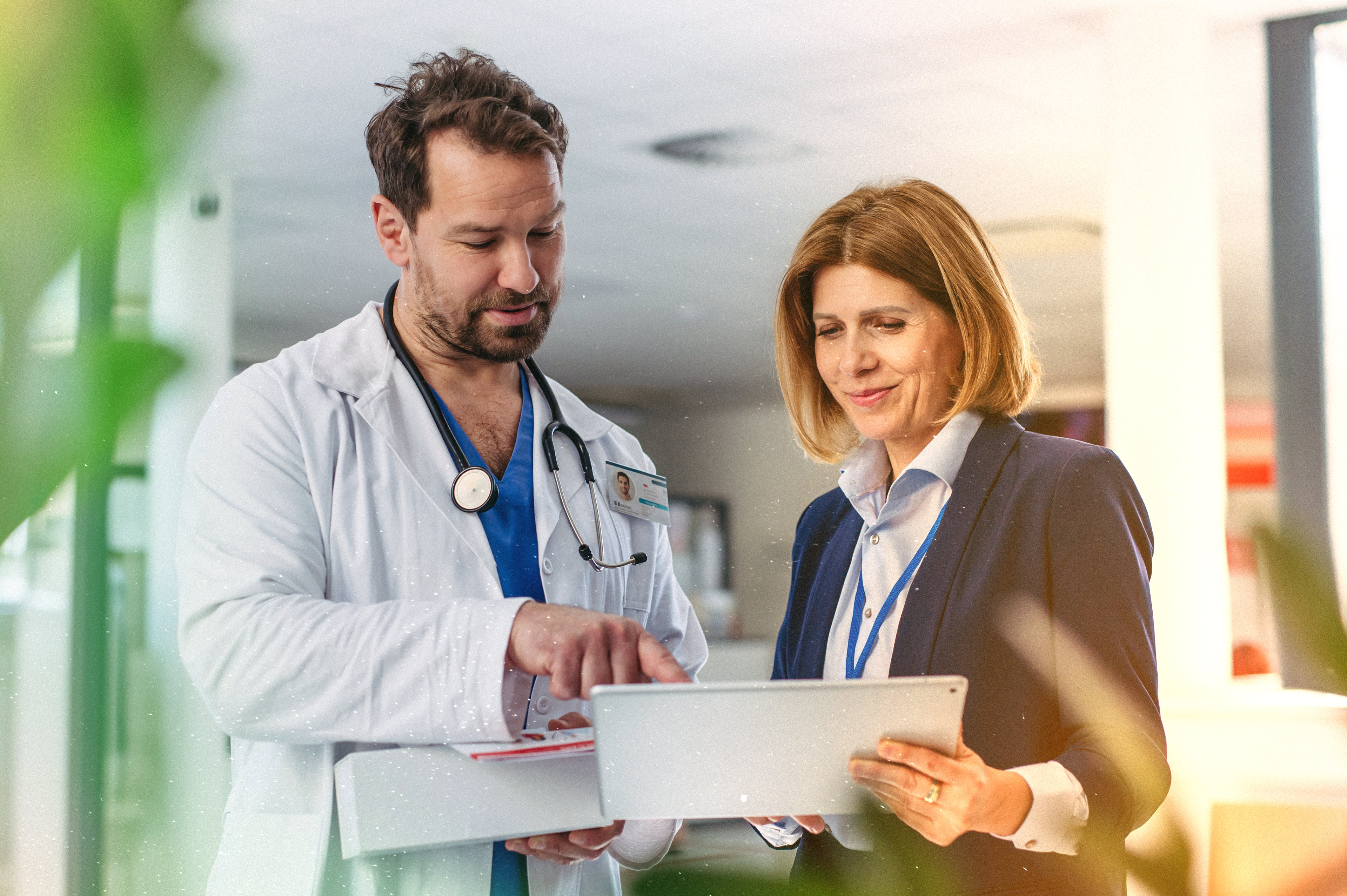 doctors talking with tablet