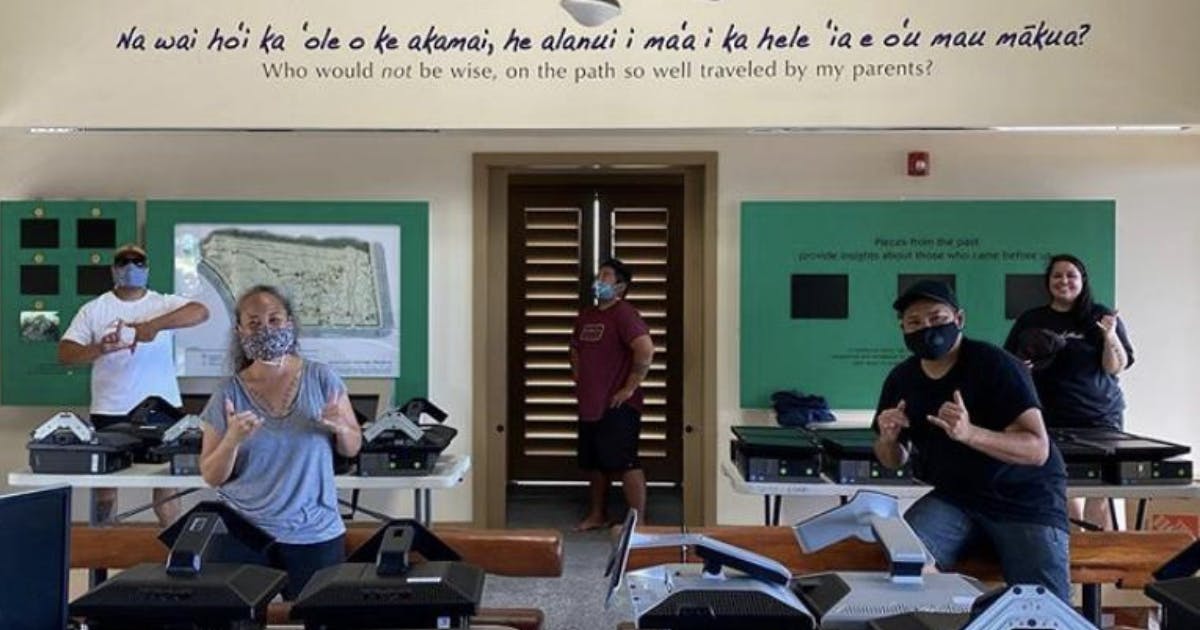 Photo of a group of volunteers collecting donated computer equipment.