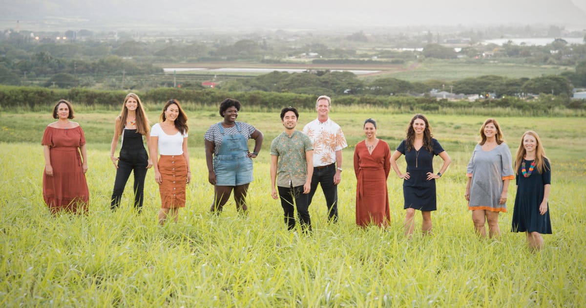 Photo of the Elemental Excelerator team of people standing outside in an open field