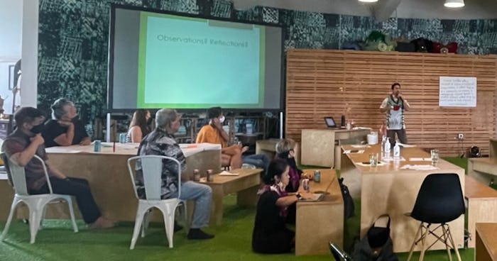Photo of Brent Kakesako facilitating a group meeting