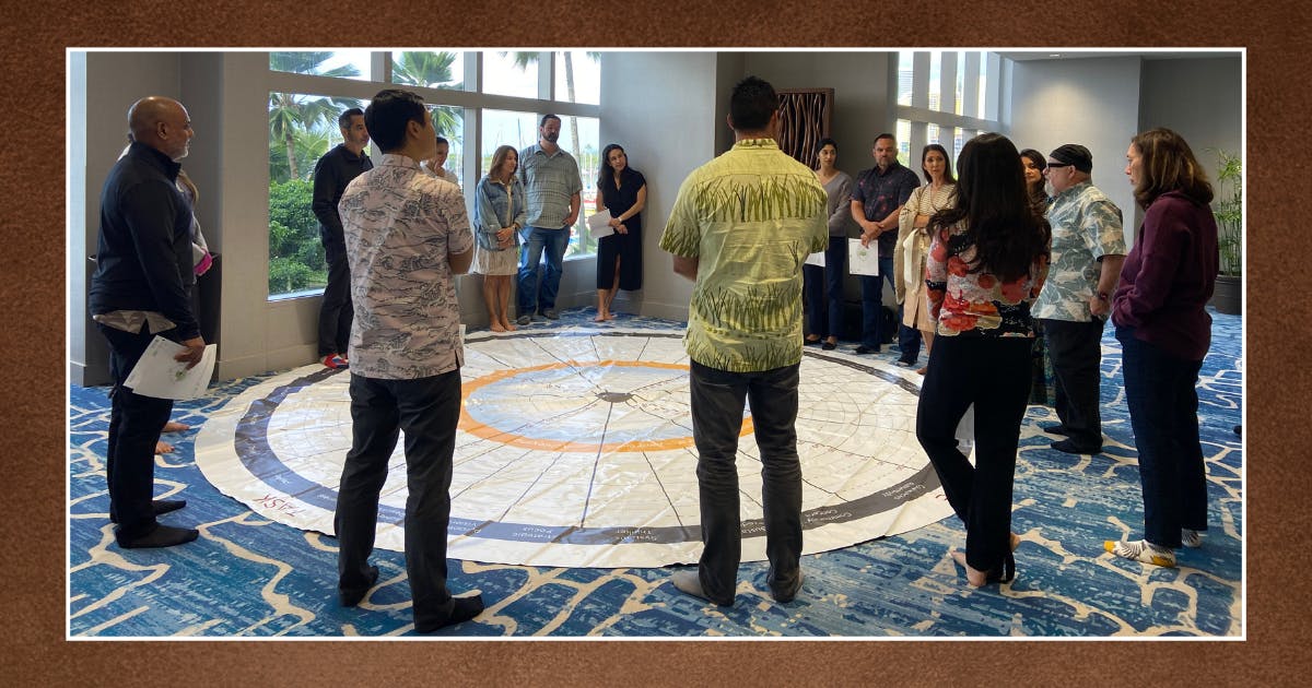 Photo of Cohort IX Omidyar Fellows standing around The Leadership Circle