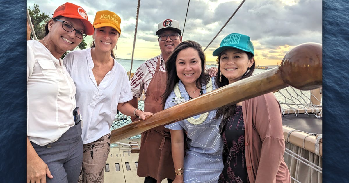 Photo of Lia Hunt, Chris Sakuda, Mark Noguchi, Meli James, and Darcie Yukimura aboard the Hōkūleʻa.