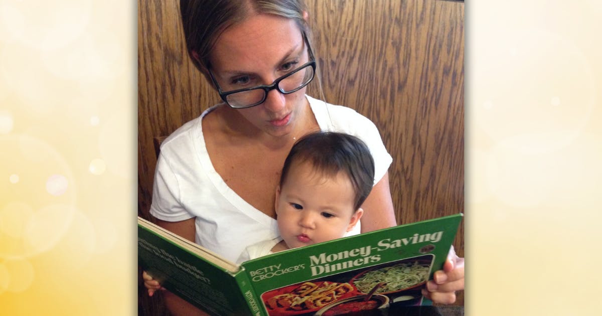 Photo of Amanda Corby Noguchi and her daughter, Aki, reading a cookbook