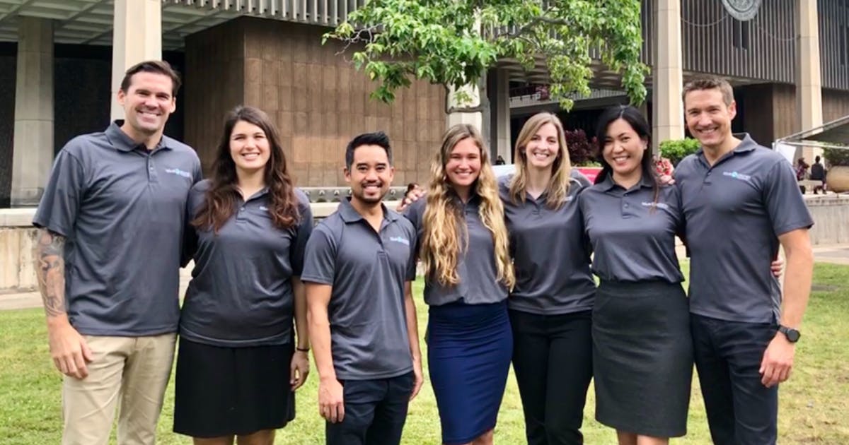 Photo of the Blue Planet team standing in front of the Hawai‘i State Capitol