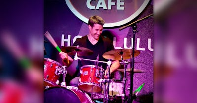 Photo of Jeff Mikulina playing drums