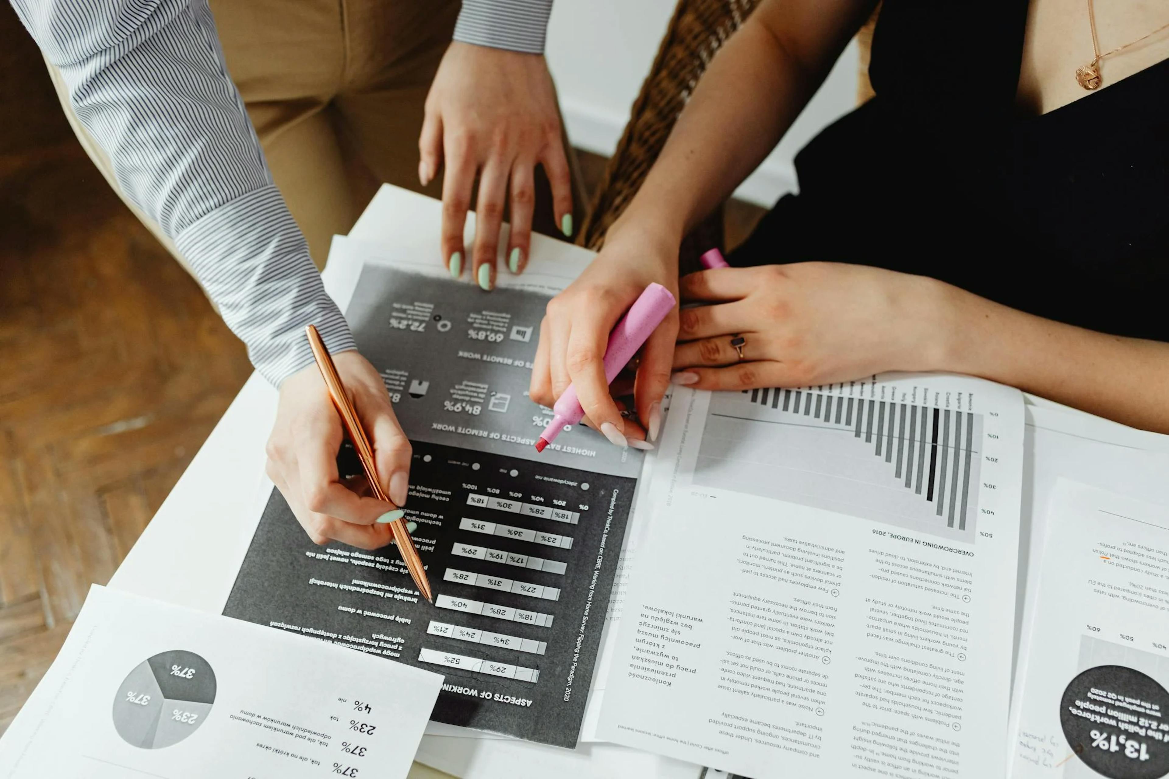 image showing people marking something on a chart
