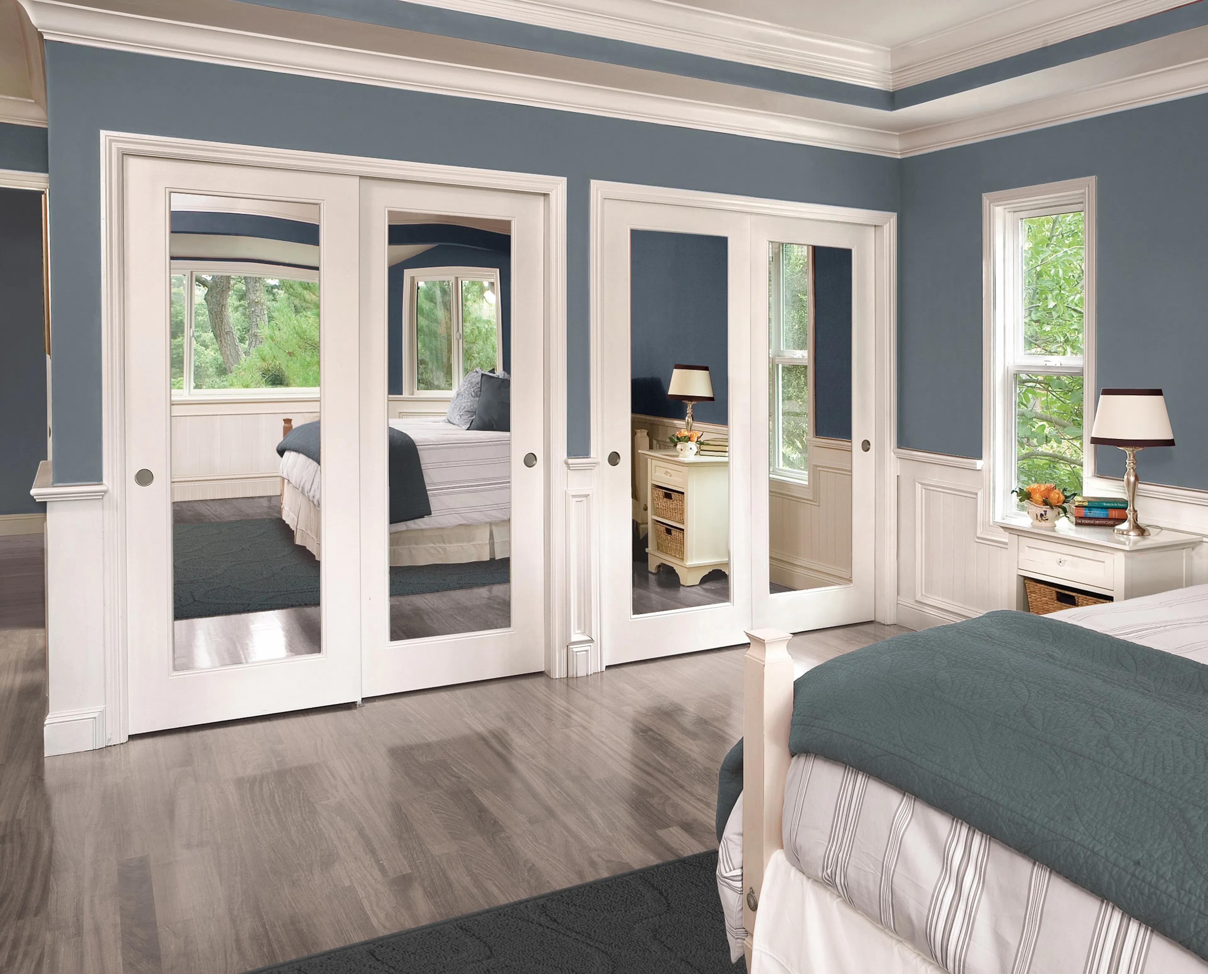 Mirrored sliding closet doors in bedroom