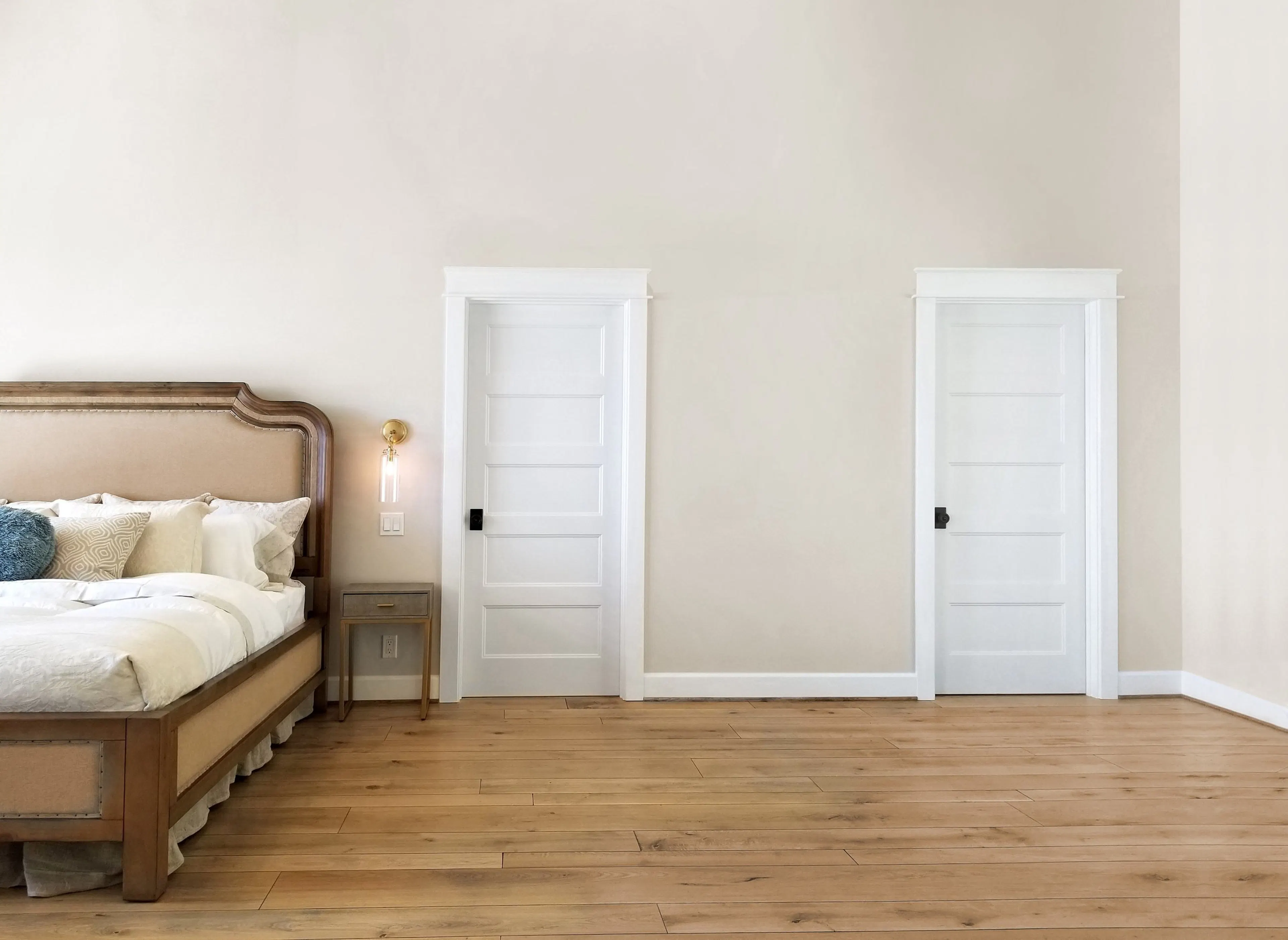 two 5 panel doors in a bedroom