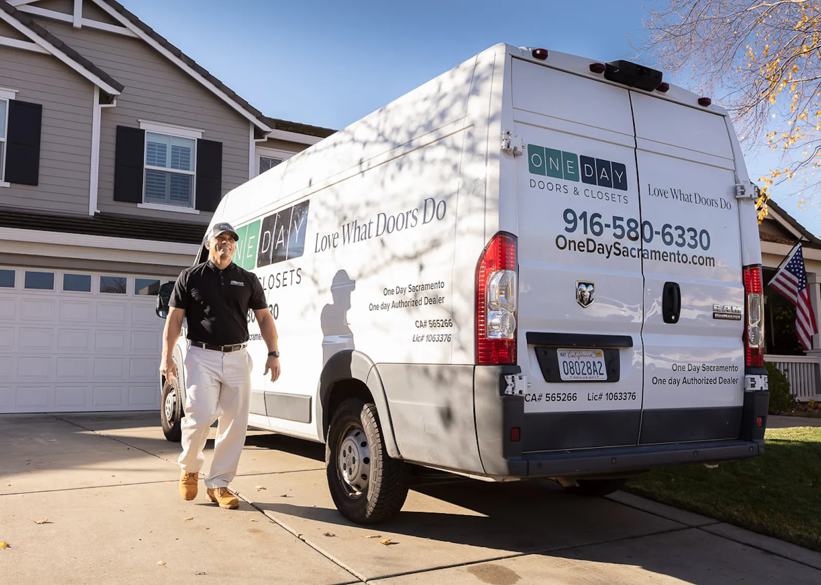 One day doors installer and van on a residential driveway.