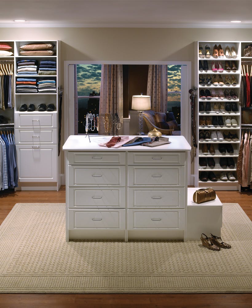 walk in closet with organization system.