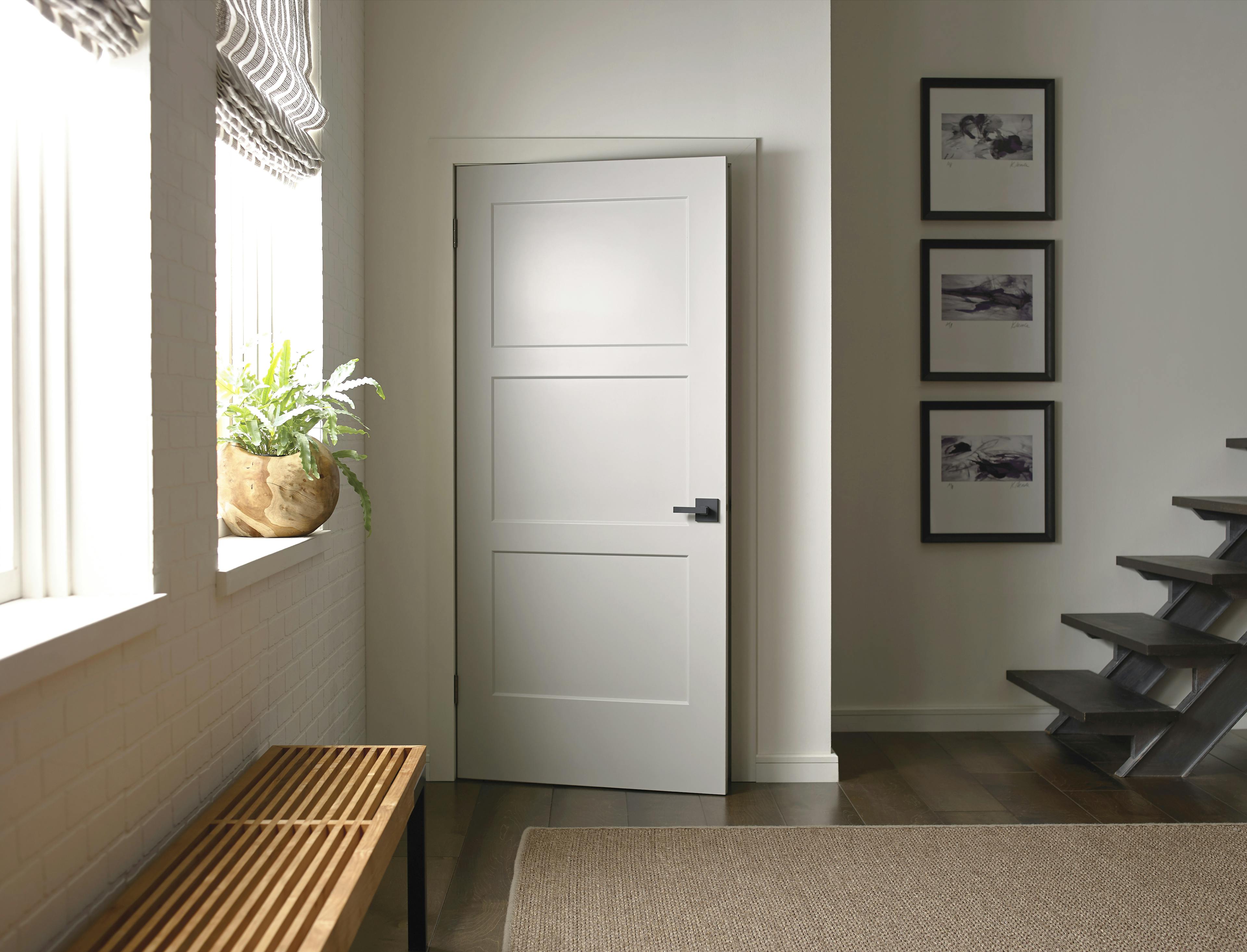 Cozy corner with white interior door and natural light.