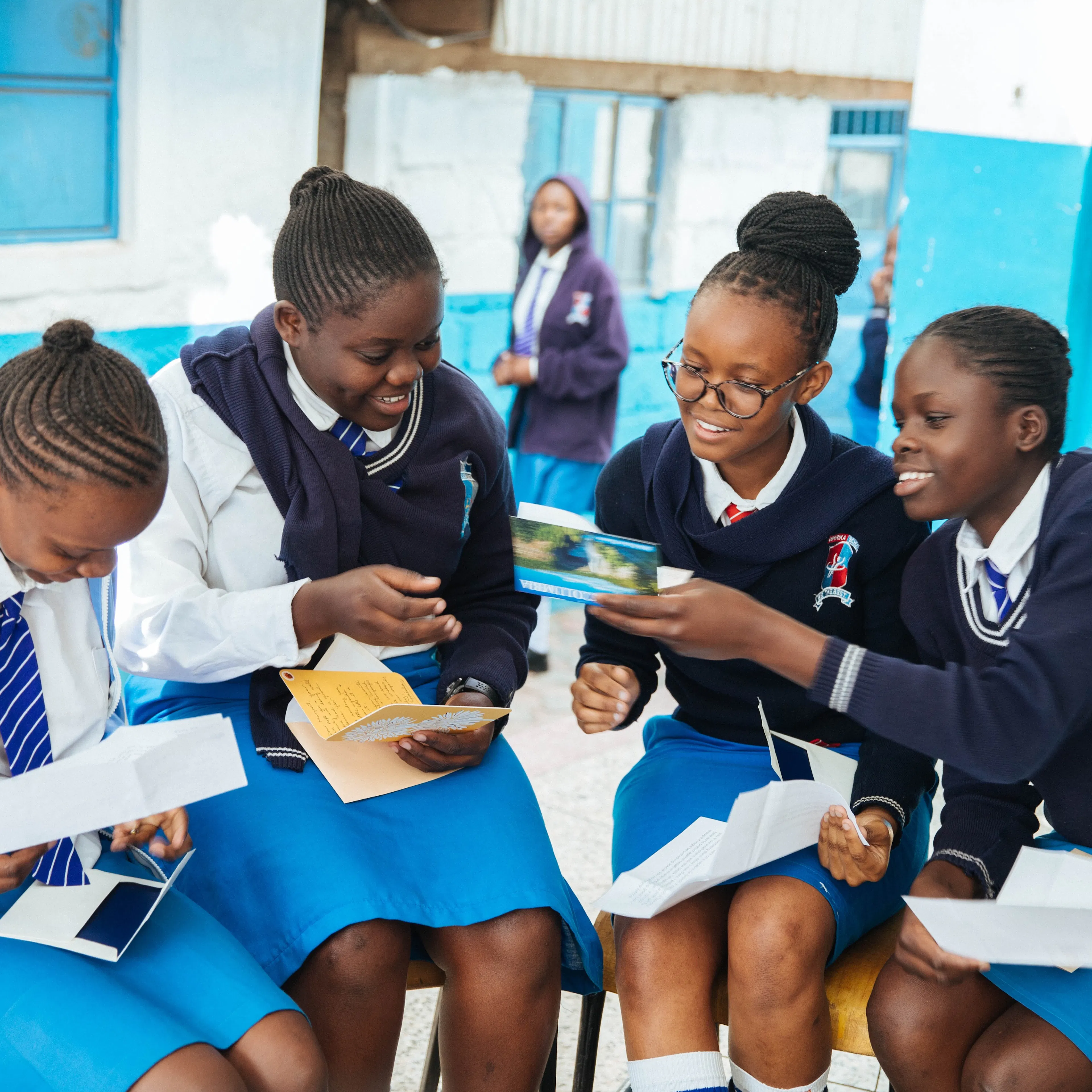 Students reading letters from their sponsors at school in Kenya