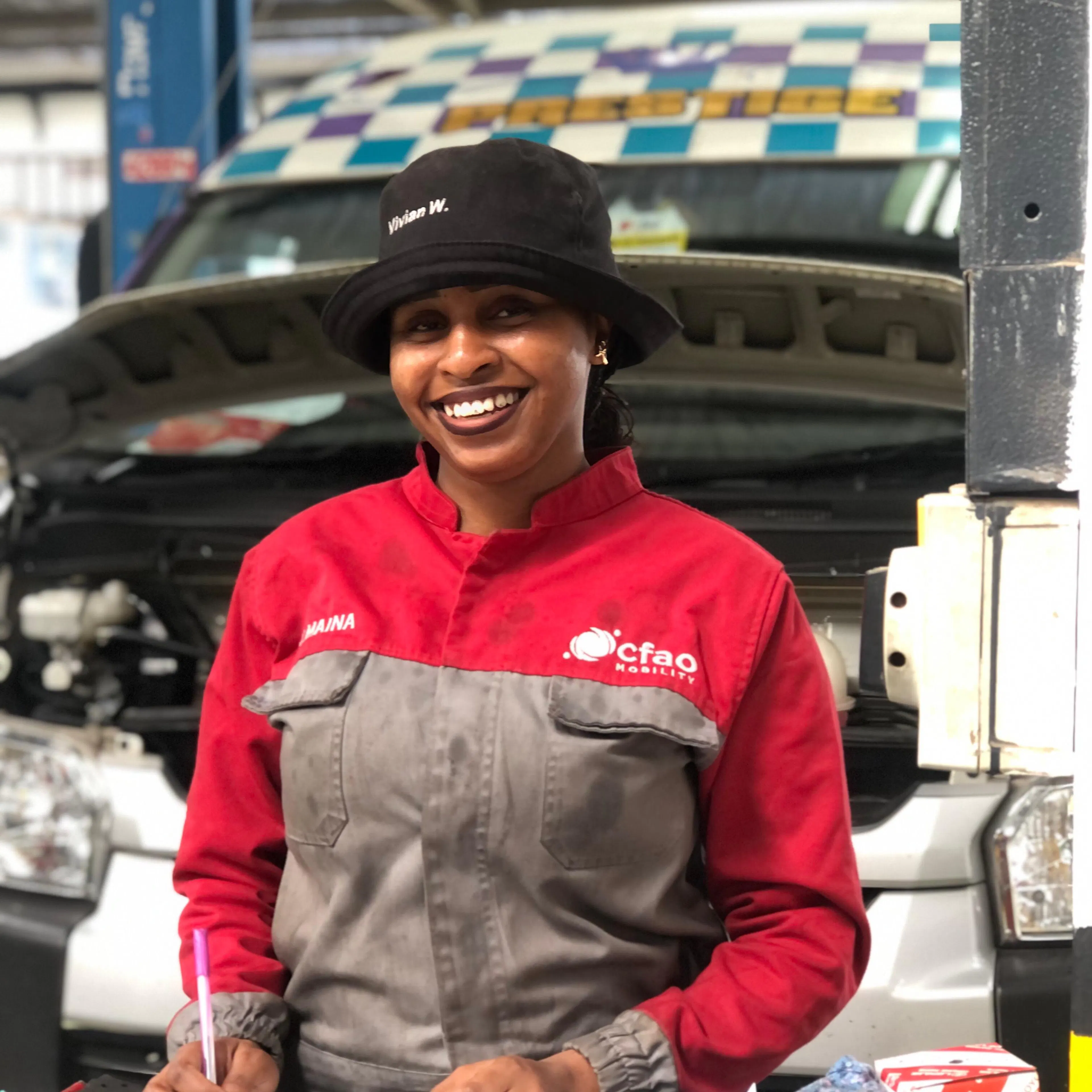 Vivian, One Girl Can university graduate, at work in an automotive workshop
