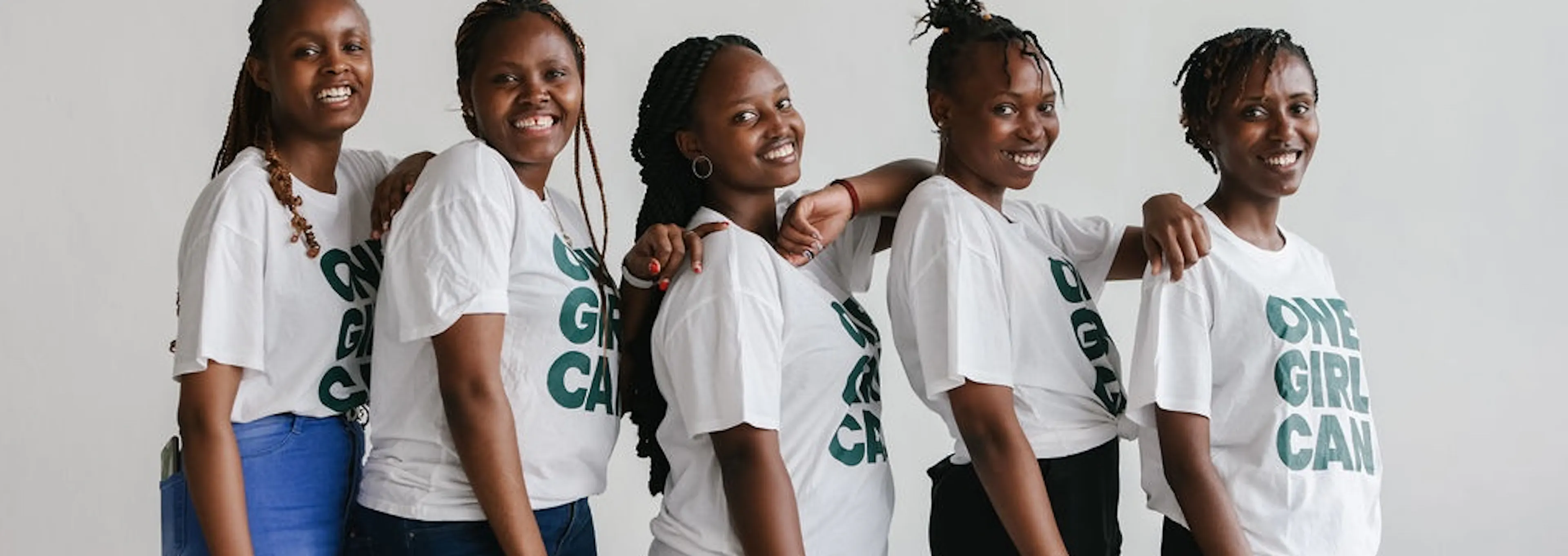 Five One Girl Can students standing side by side in branded t-shirts
