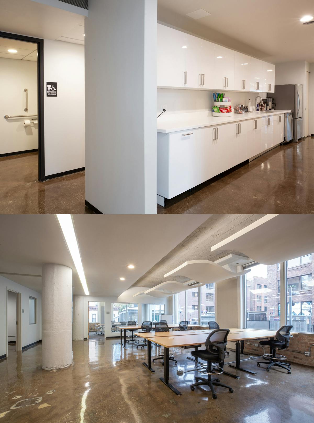 A handicap accessible bathroom, a kitchen with cupboards, refreshments, and a refridgerator, and a workspace with multiple long tables surrounded by chairs, with large windows looking out into the city.