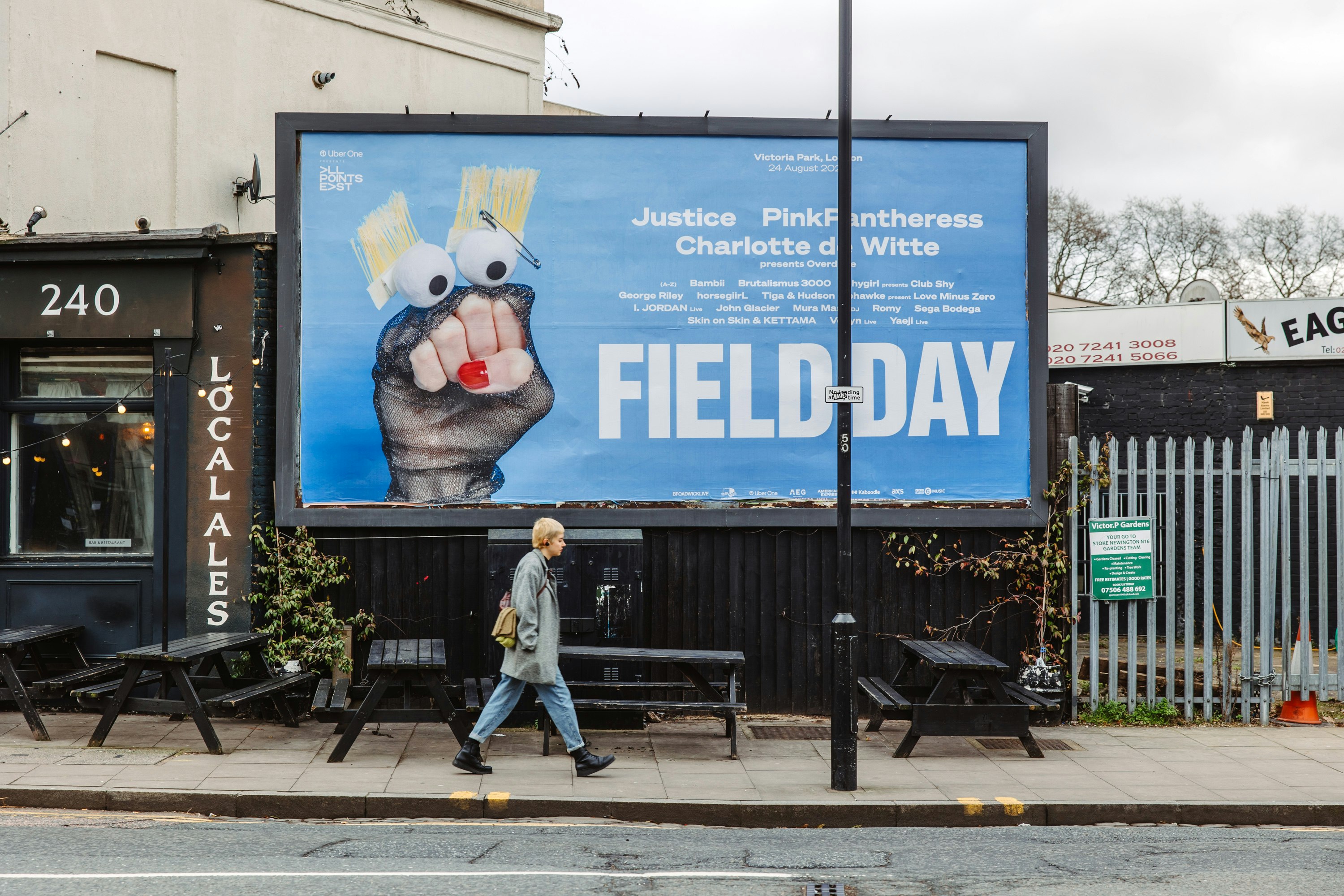A large billboard advertising Field Day, featuring a sheer puppet on a blue background.