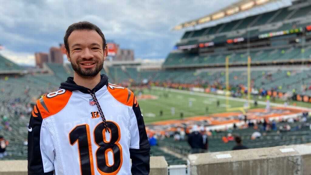 Young man at NFL football game 