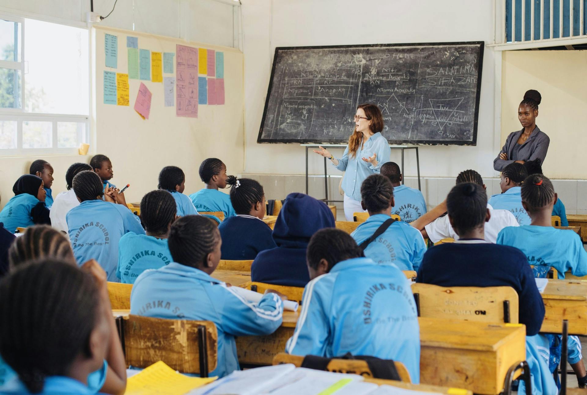 Woman talking at whiteboard