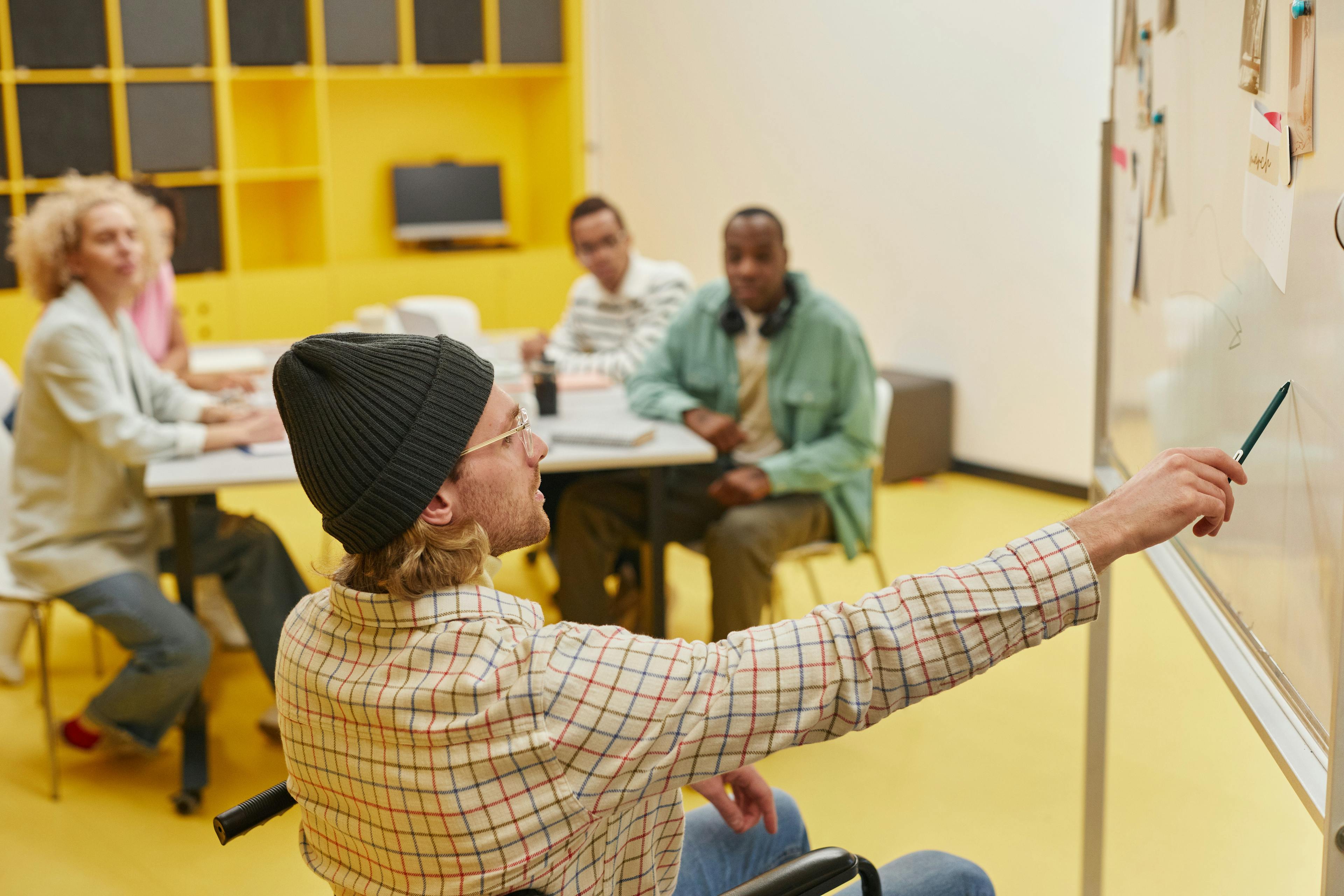 group of people looking at the board