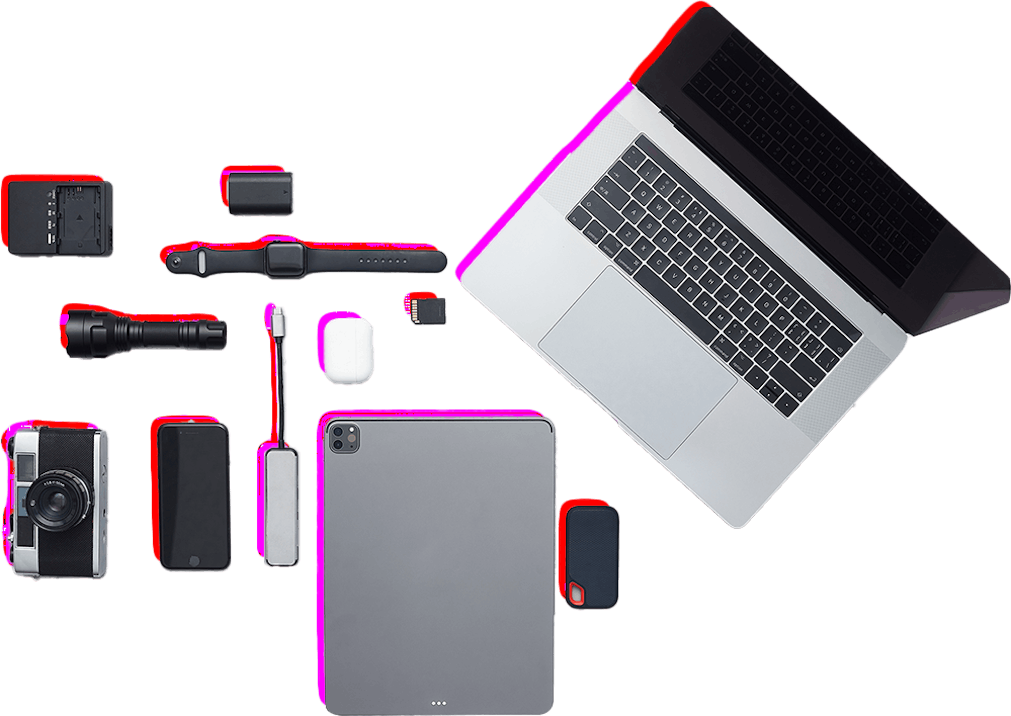 A laptop, phone, camera and other items are laid out on a white background.