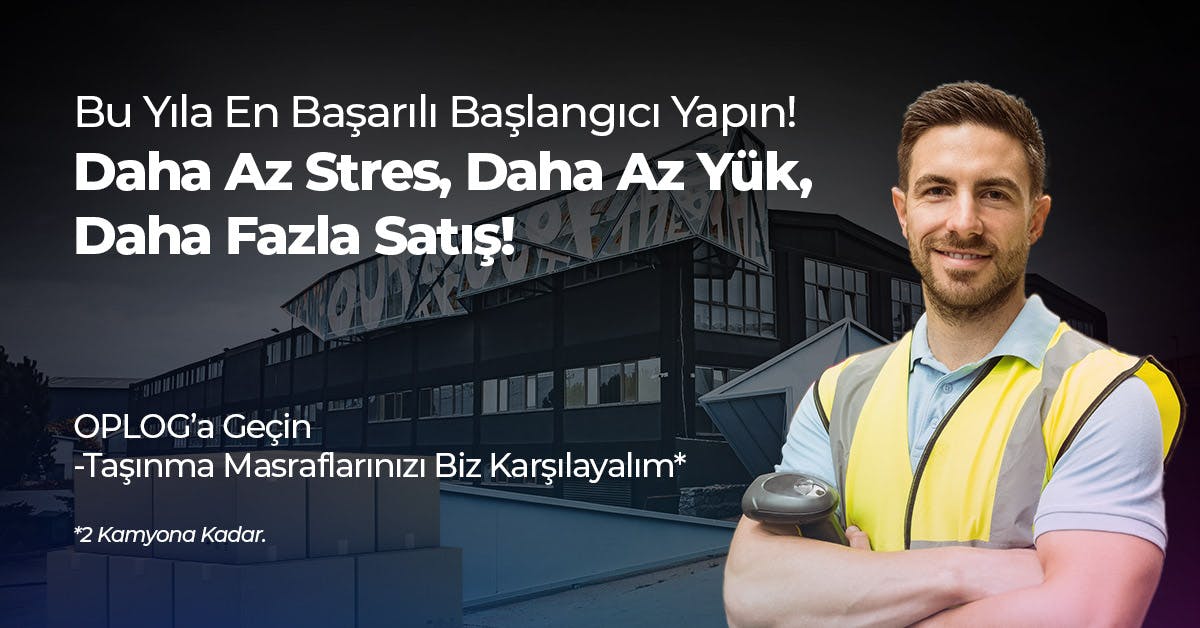 A man is standing in front of a building with a sign