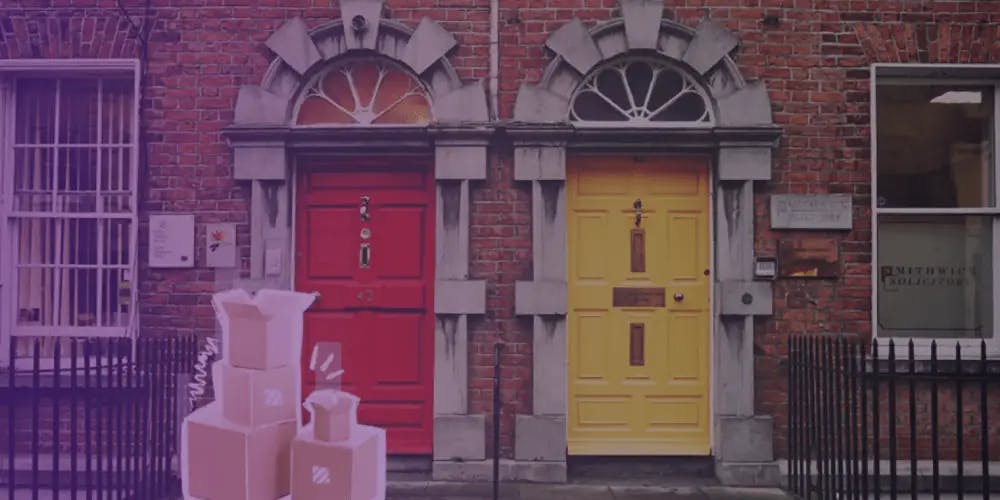 Two doors and boxes in front of one of them