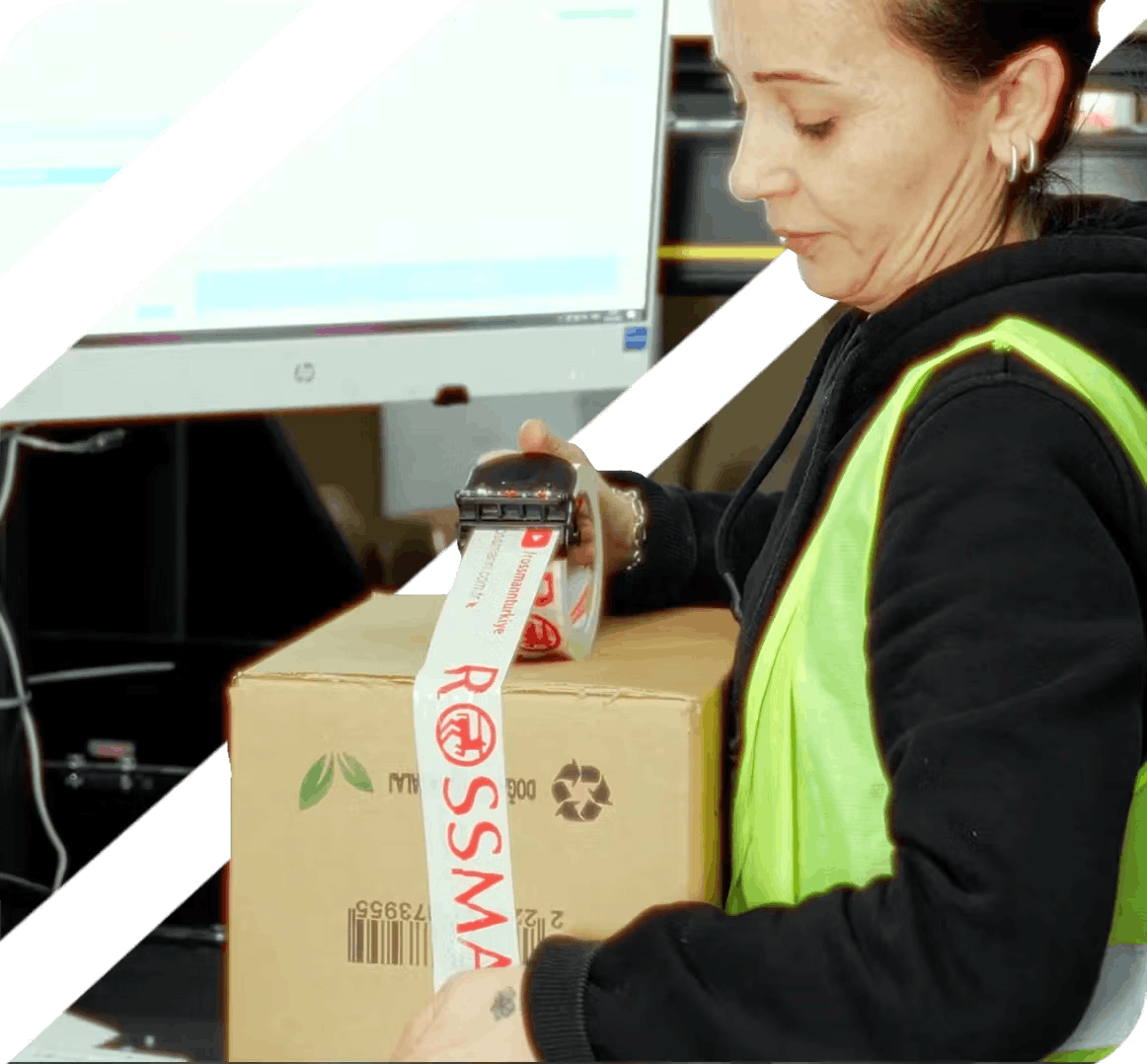 Warehouse worker sealing package with security tape