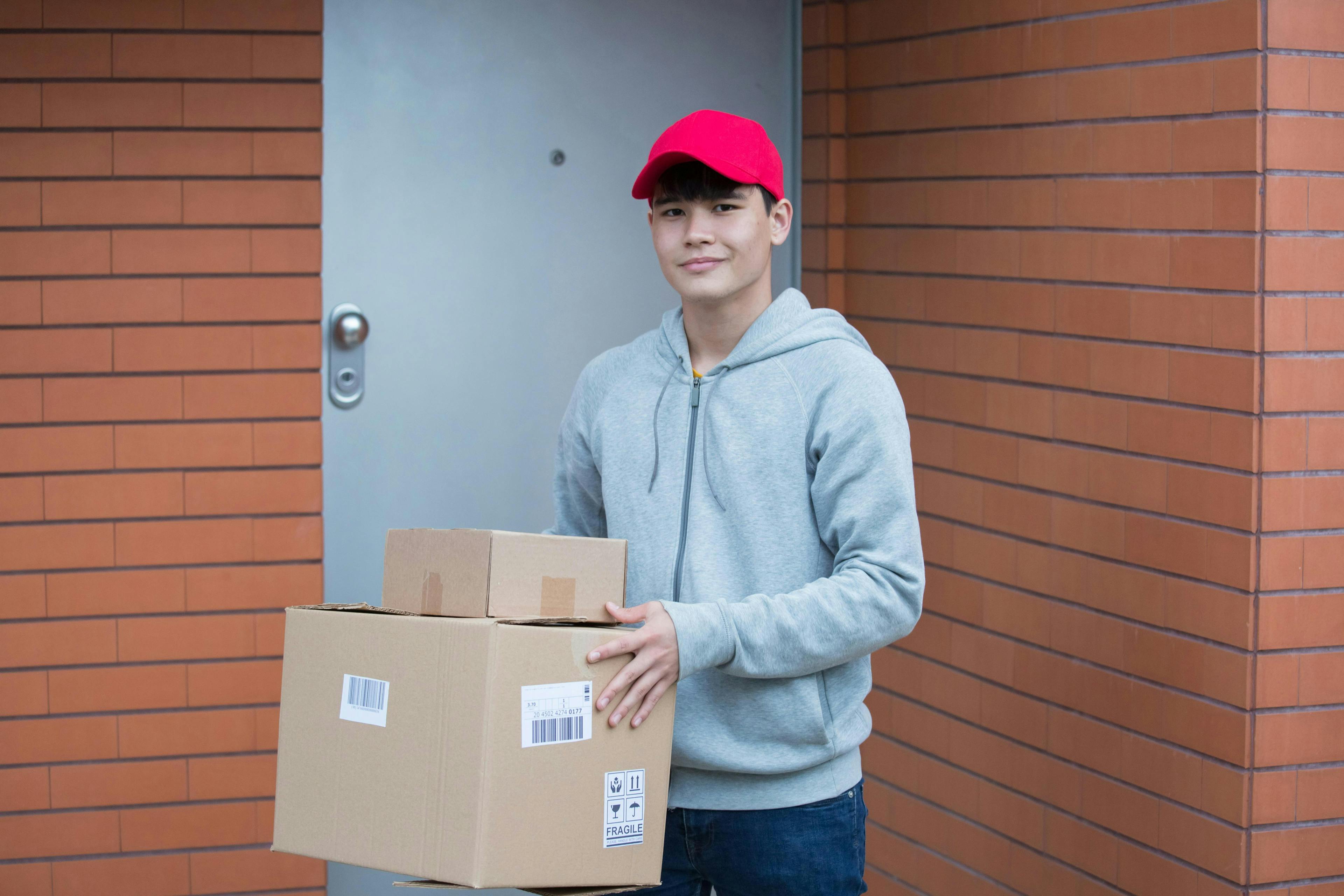  a courier holding packages