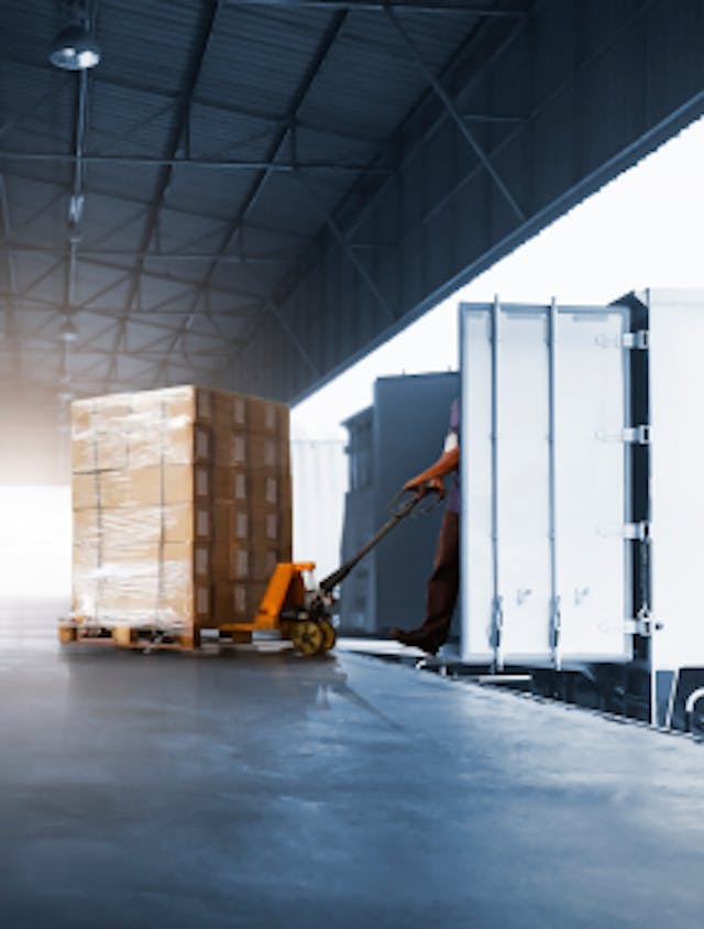 boxes on pallets are placed on the lorry