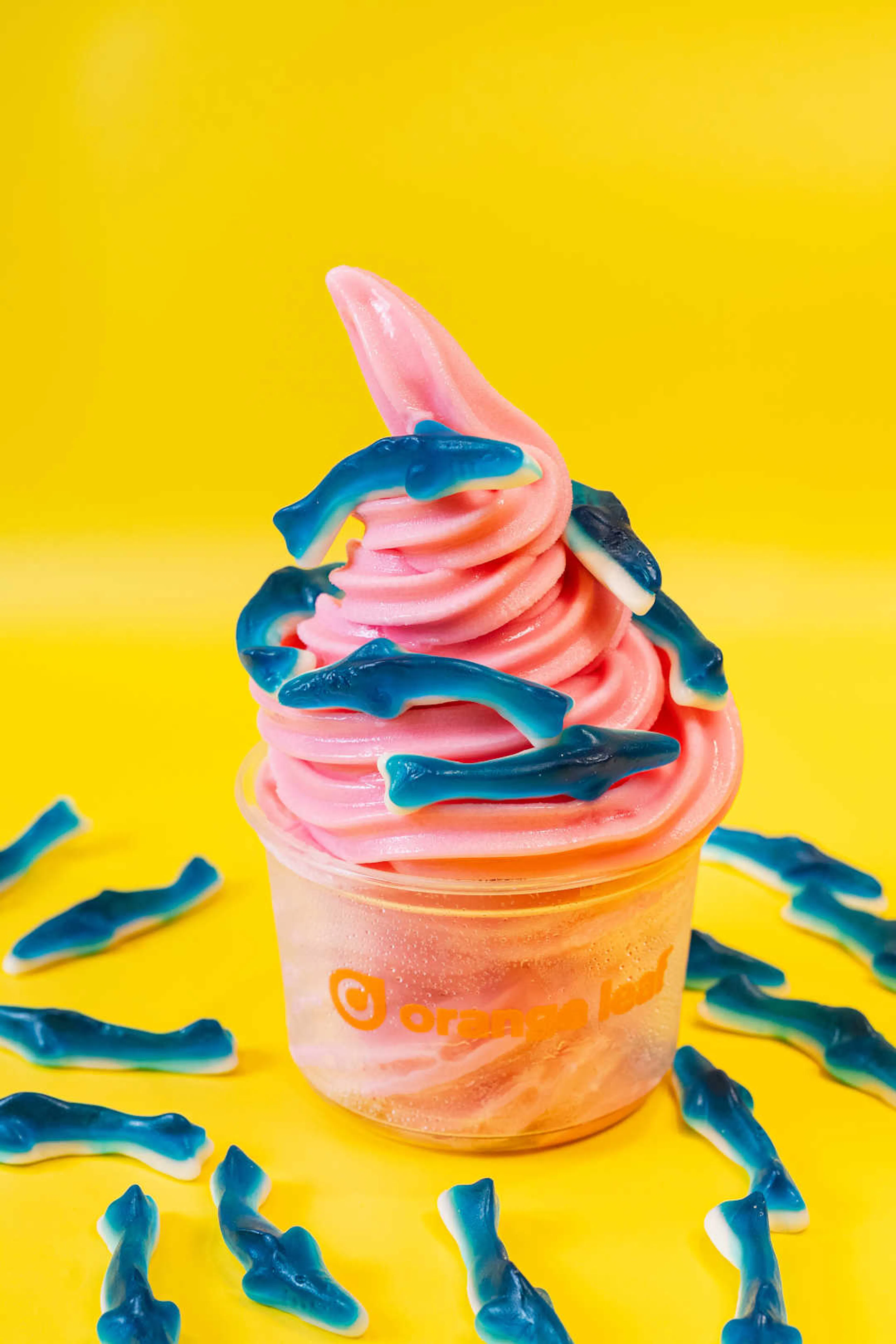 cup of frozen yogurt with gummy sharks