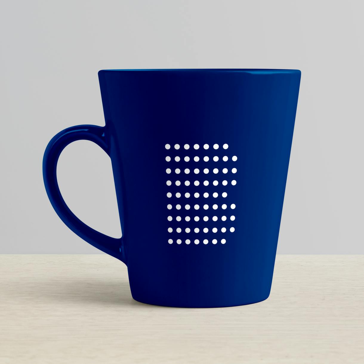 A dark blue mug with the Booking Holdings logo