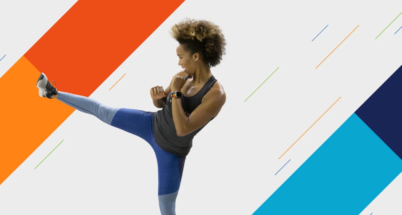 Woman in athletic wear performing a sidekick with a graphic background