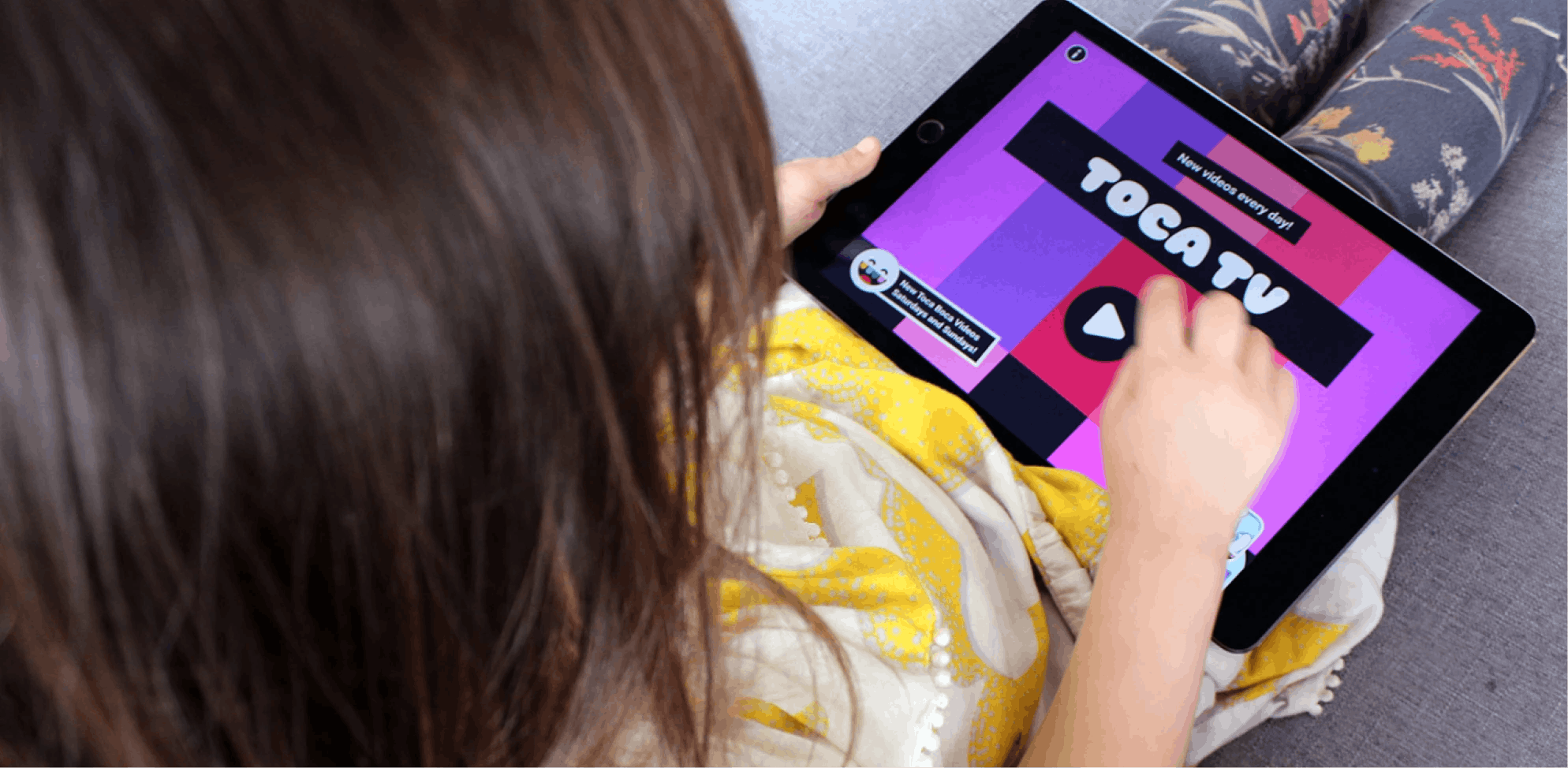 Kid using Toca TV on ipad