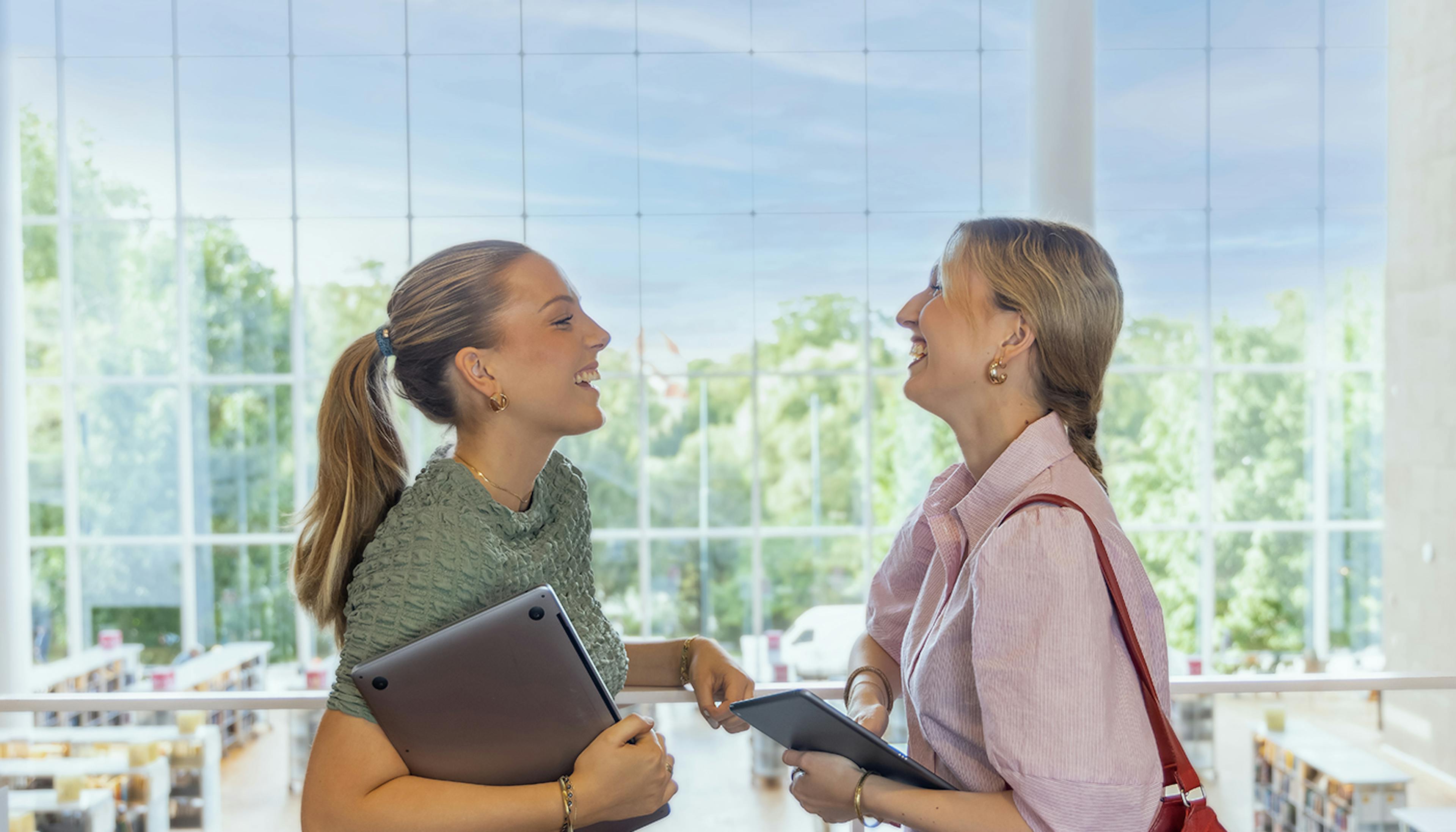 Two Students laughing