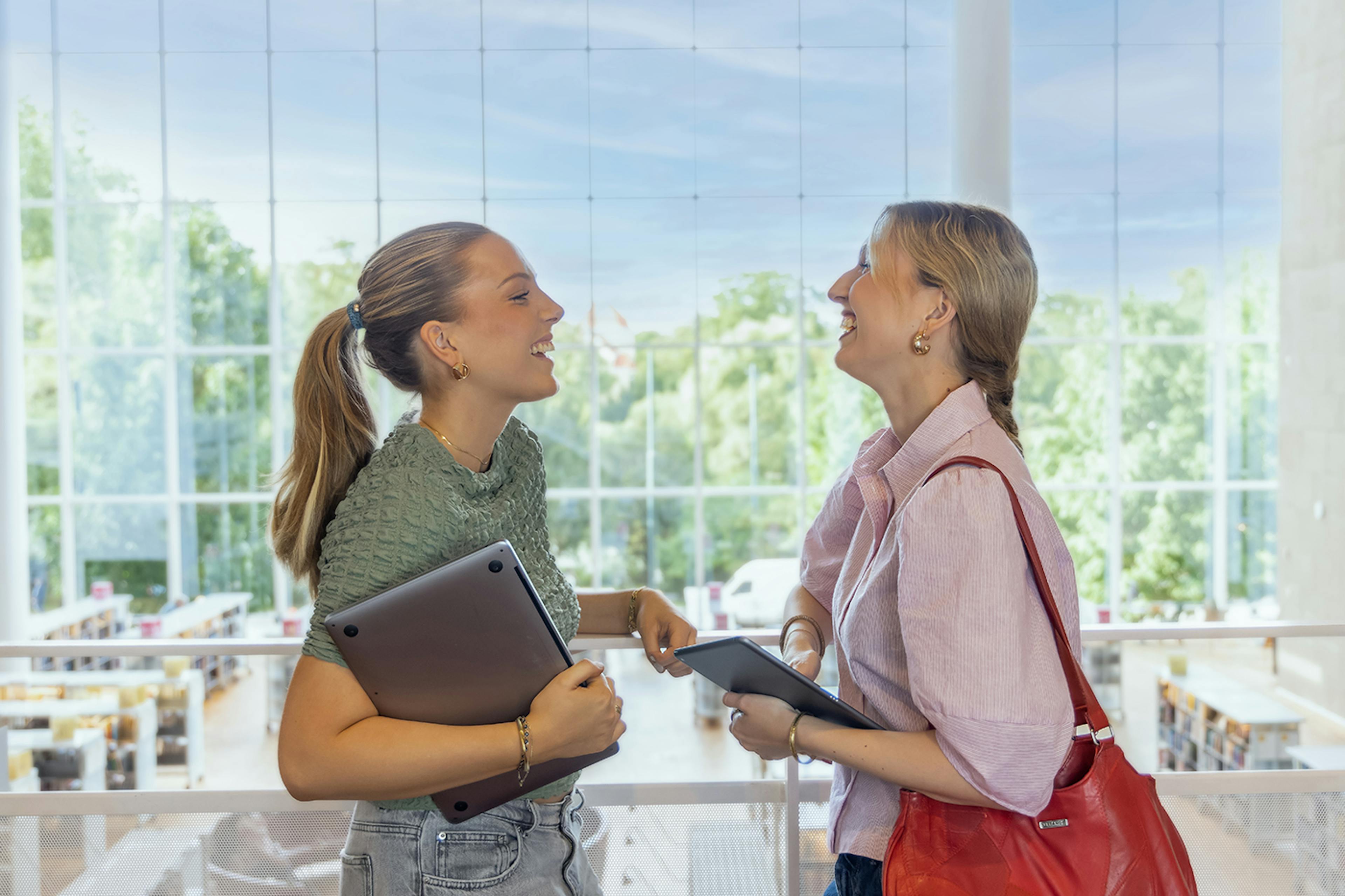 Two Students laughing