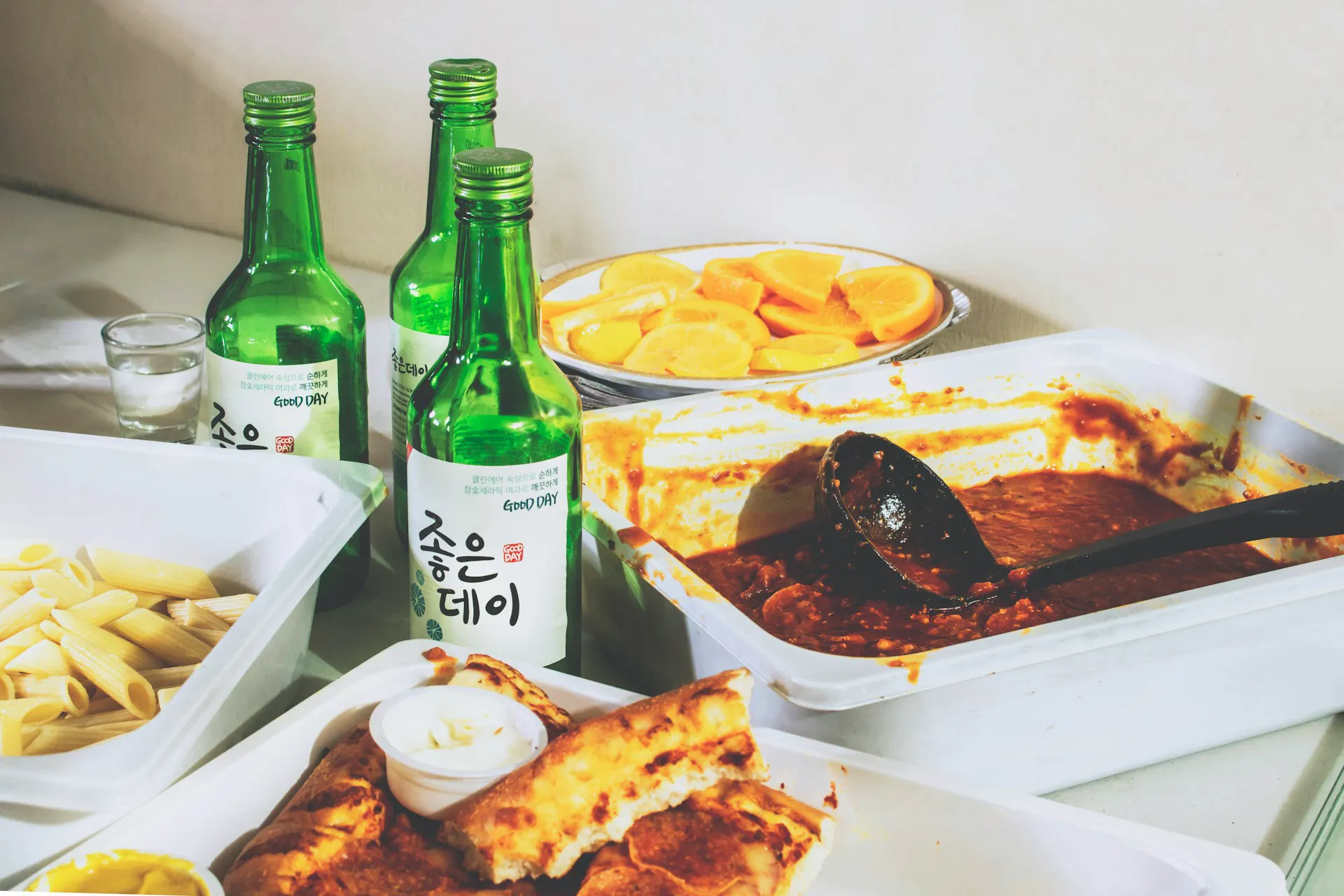 Three bottles of soju at a Korean dinner party