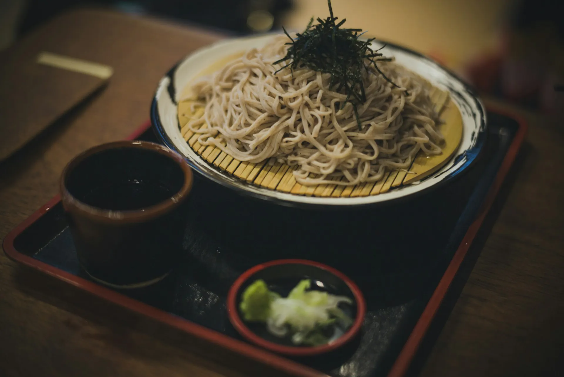 Soba noodles with dipping sauce and condiment