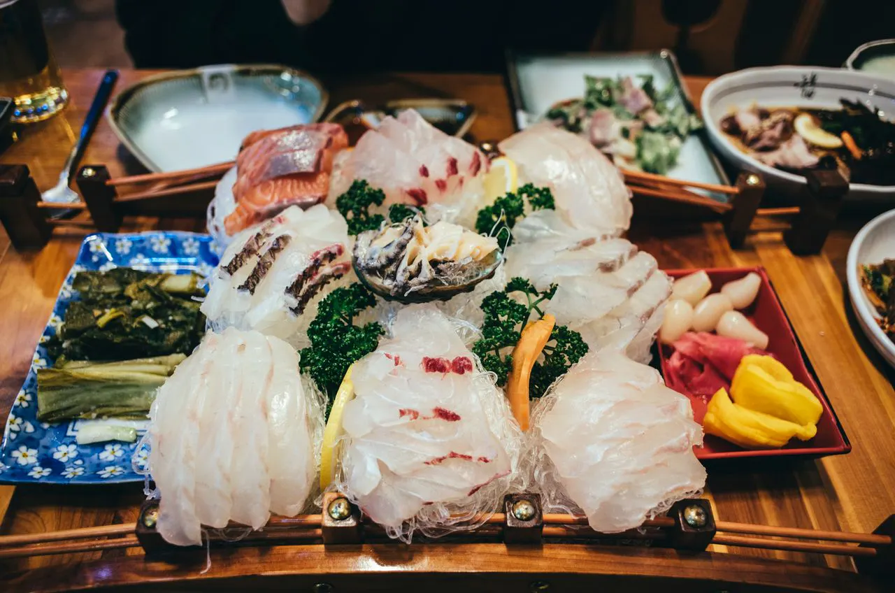 plate of sashimi and other dishes