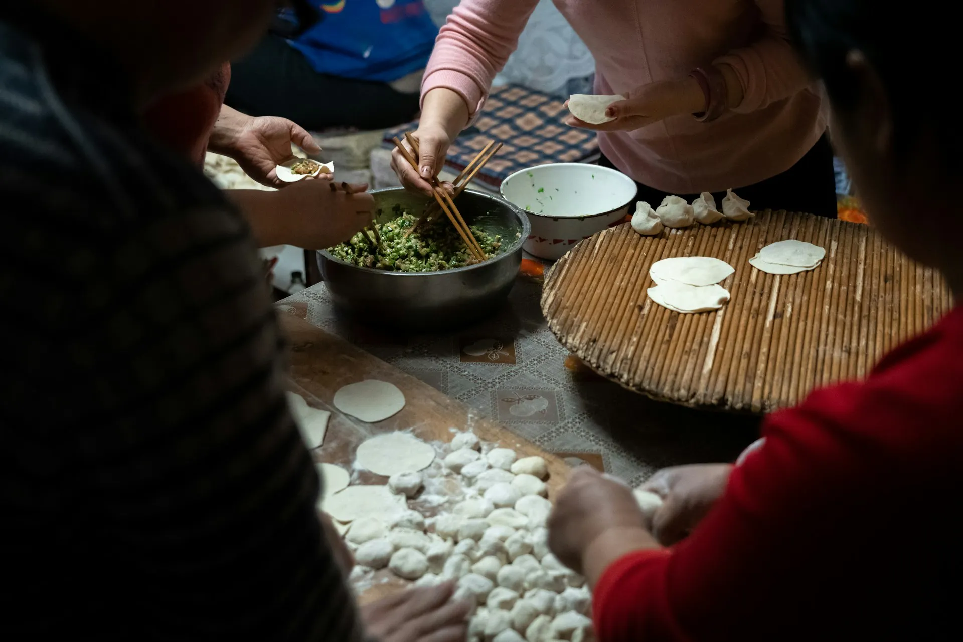 People making dumplings together