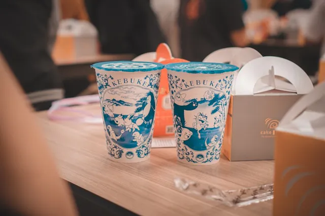 Two takeaway coffee cups in a Taiwanese cafe