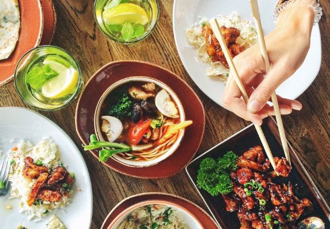 A table full of different Asian dishes 