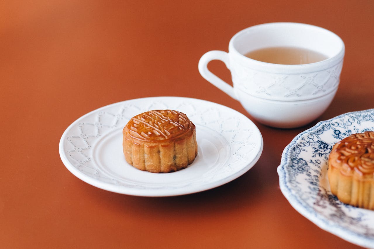 Mooncakes on plate with a cup of tea