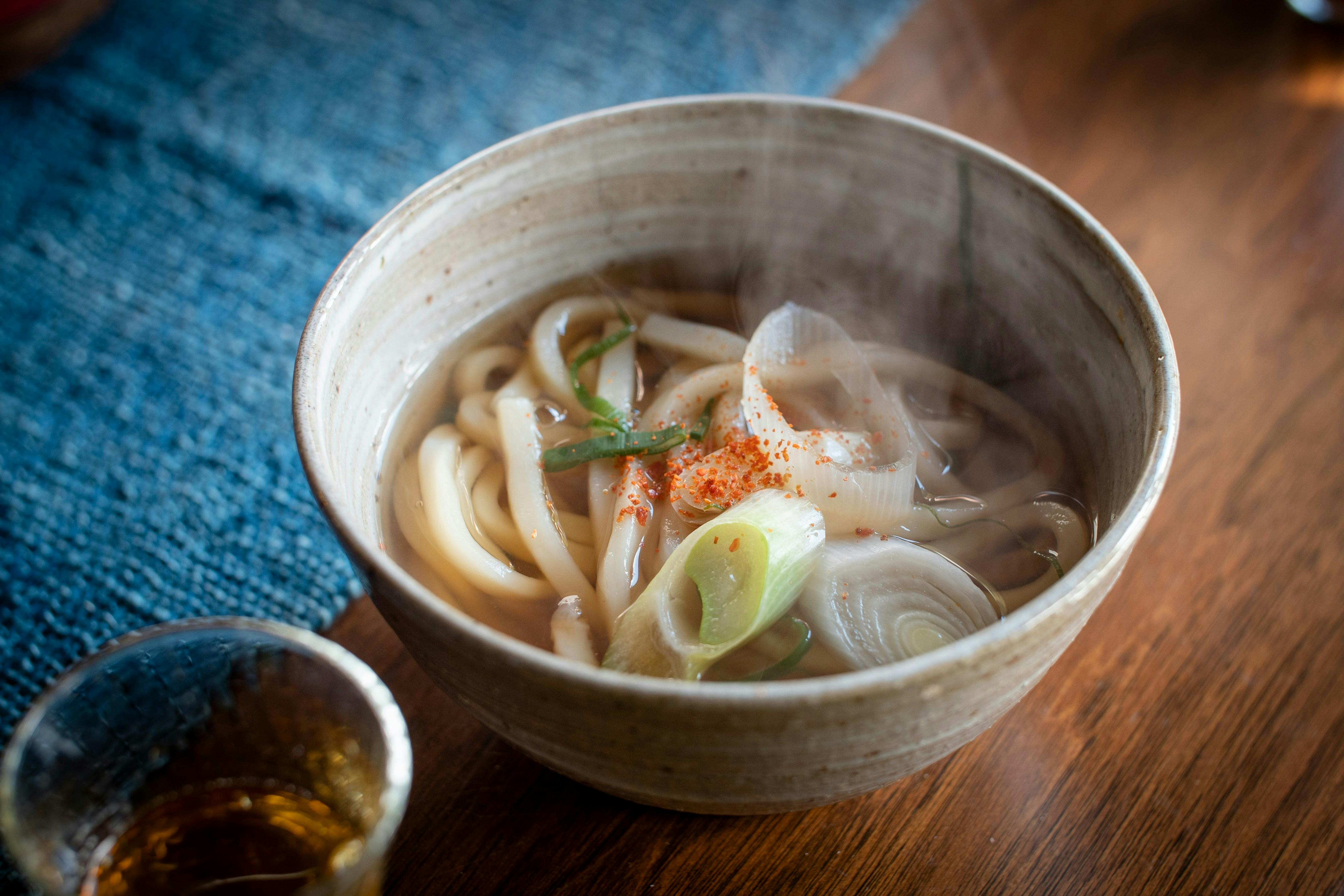 Vegan udon noodles in a hot soup