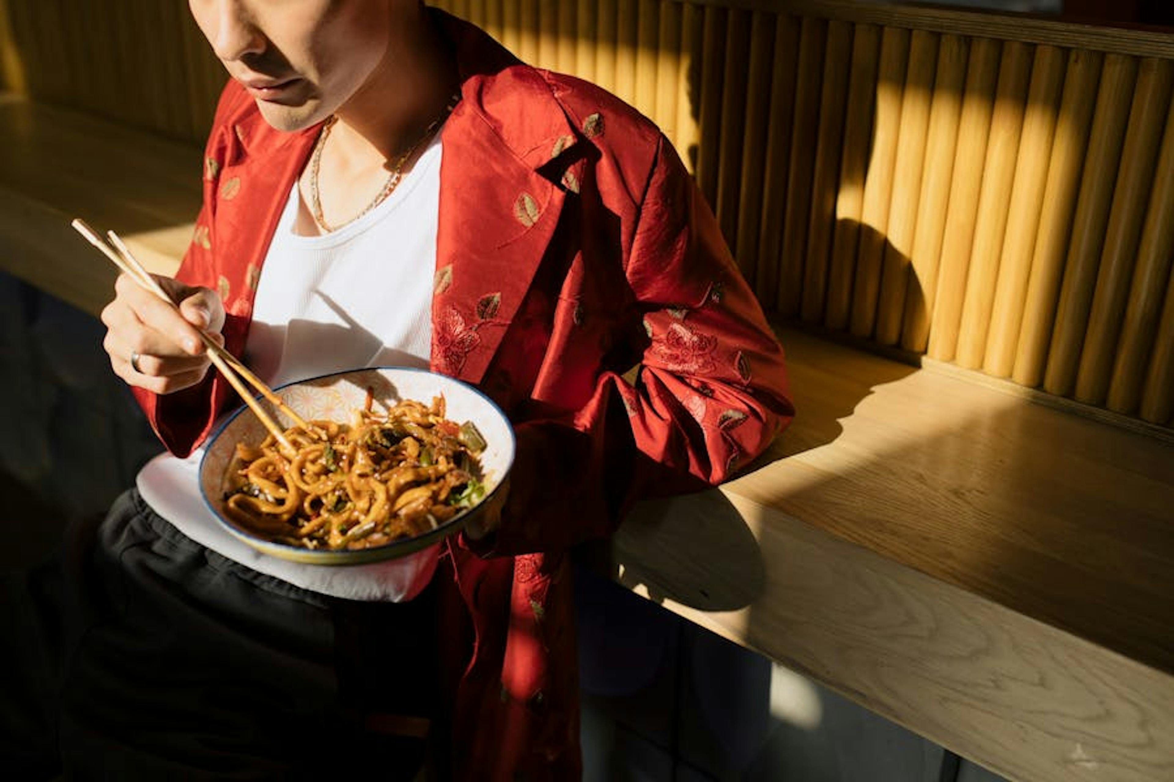 Man eating noodles