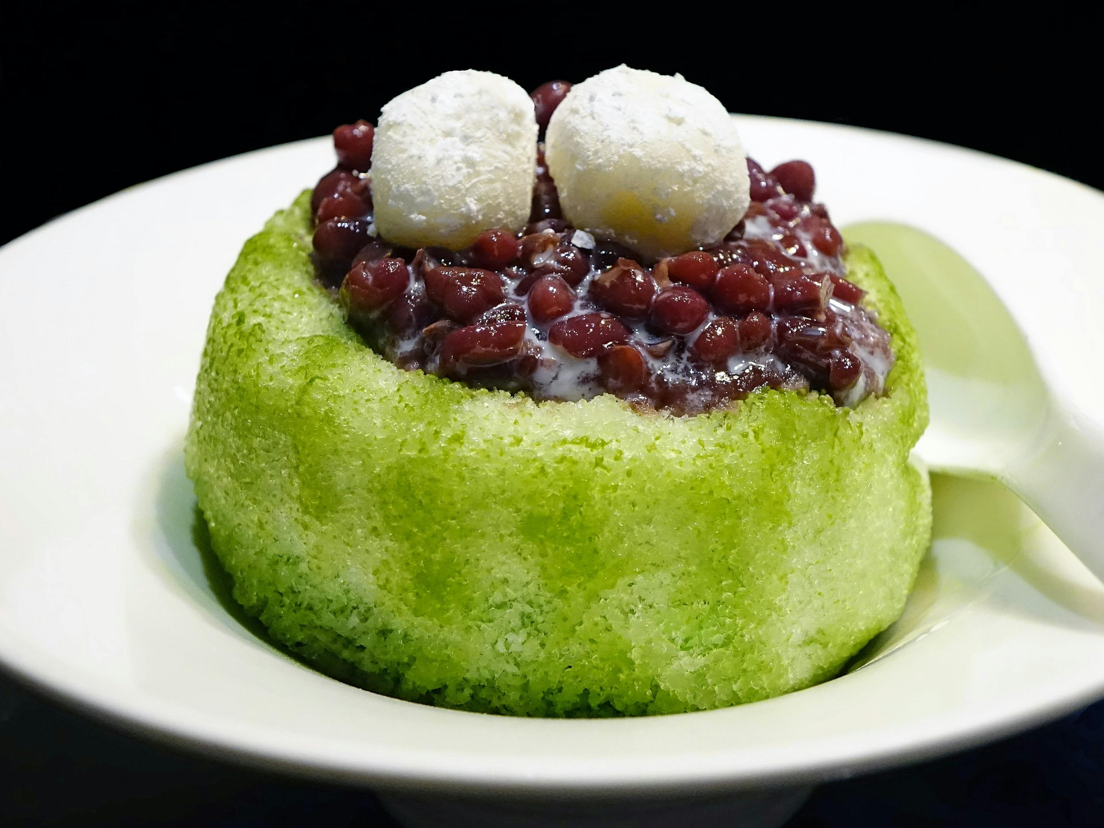 A Japanese dessert topped with red beans